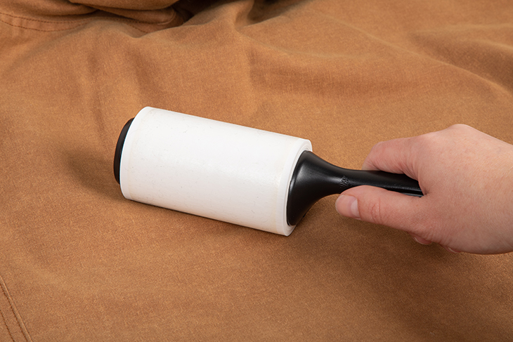 Use a lint roller to remove particles.